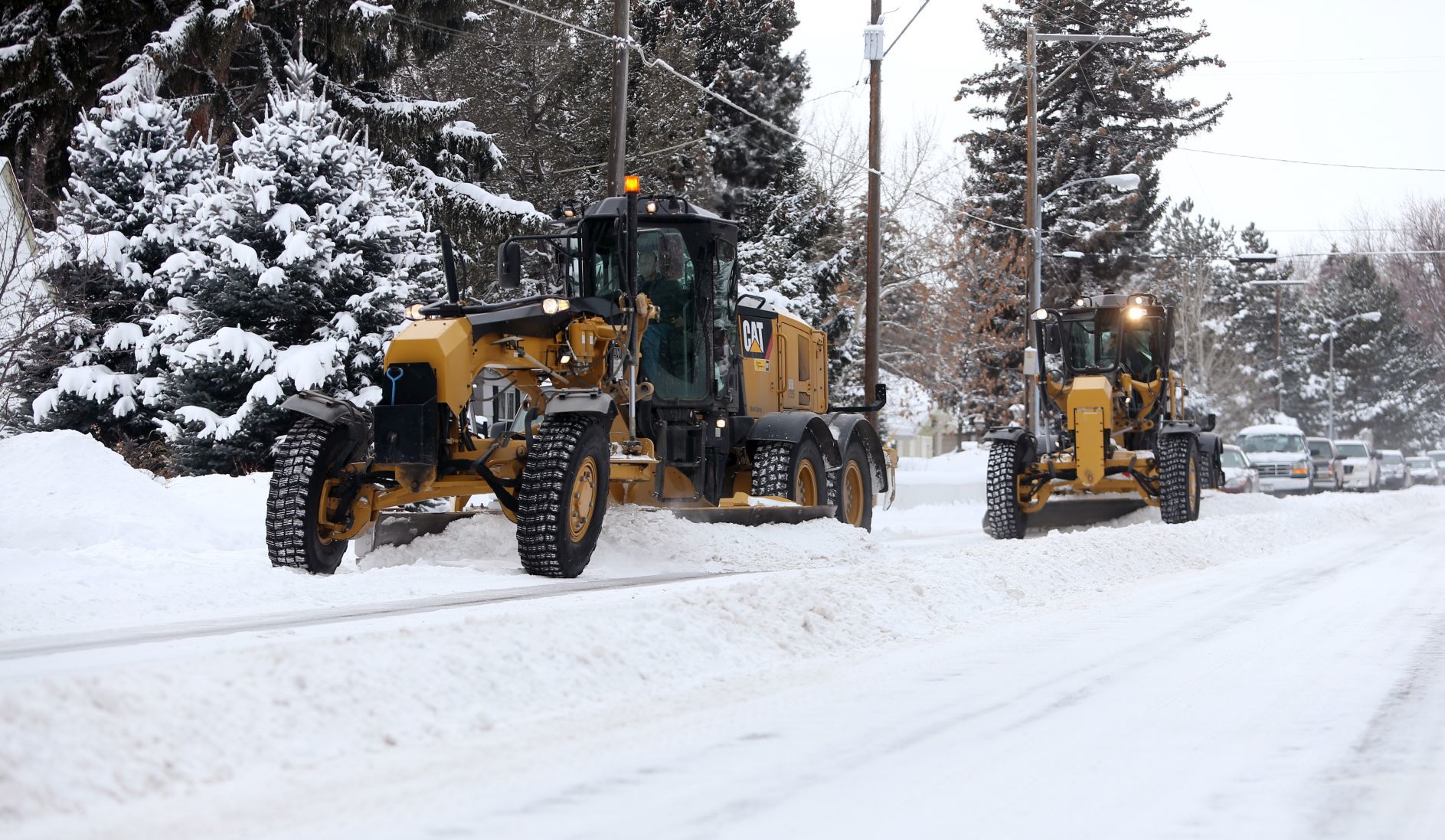 Snowplow crews form a berm